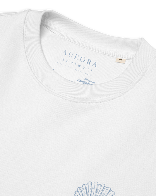 White organic sweater with a small shell print on the chest, Aurora Soulwear.