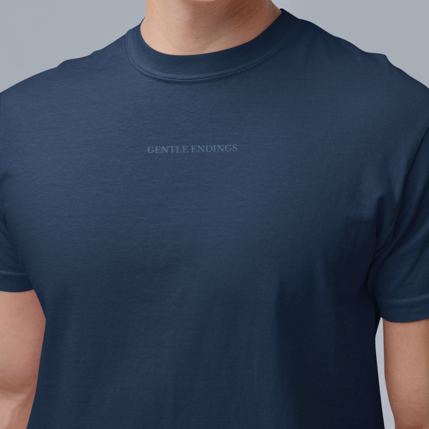 Gentle Endings Organic T-shirt in navy blue with star and Gentle Endings Tender Beginnings back print
