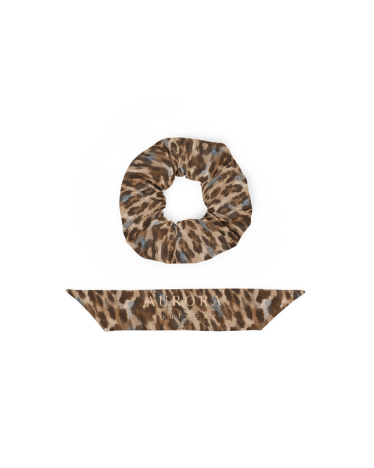 Leopard-print hair scrunchie with removable bow, from Aurora Soulwear's Heatwave collection.