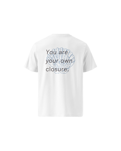 White organic cotton t-shirt with a small shell print on the chest, Aurora Soulwear.
