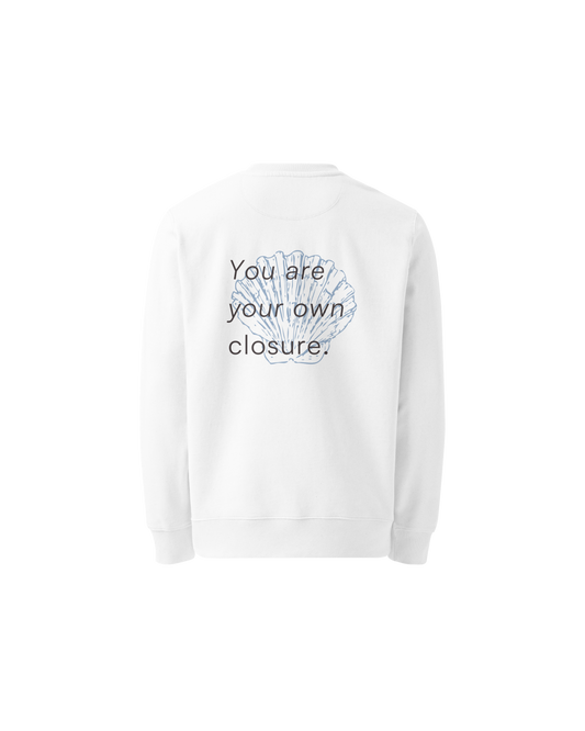 White organic sweater with a small shell print on the chest, Aurora Soulwear.
