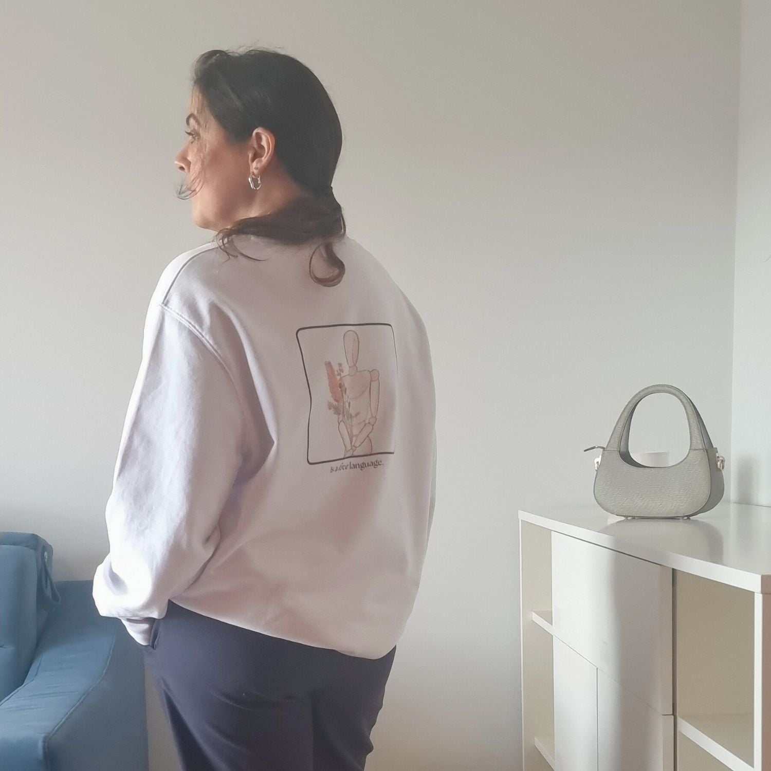Consistency Organic Sweater in white with Consistency Is A Love Language back print and hand-drawn illustration