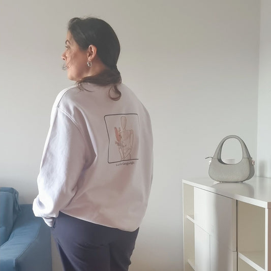 Consistency Organic Sweater in white with Consistency Is A Love Language back print and hand-drawn illustration
