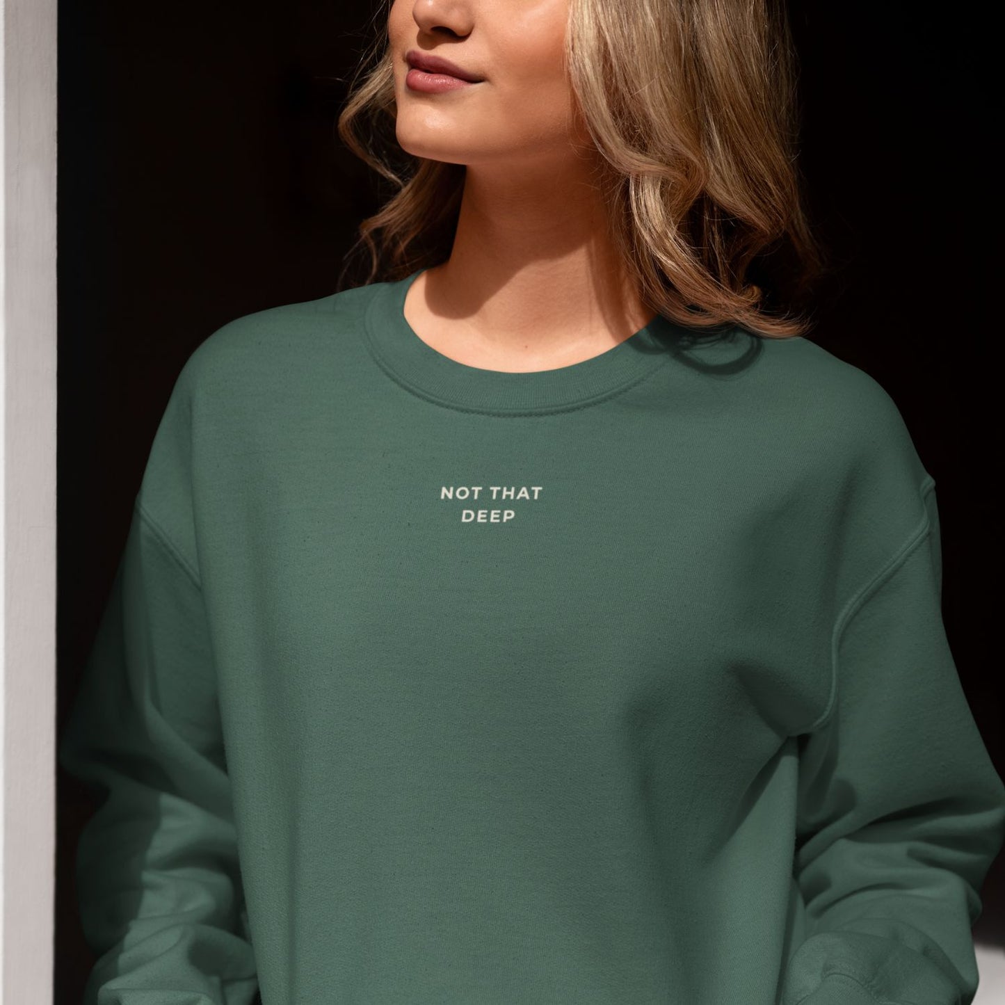 Deep Recycled Sweater in forest green with Not That Deep front print
