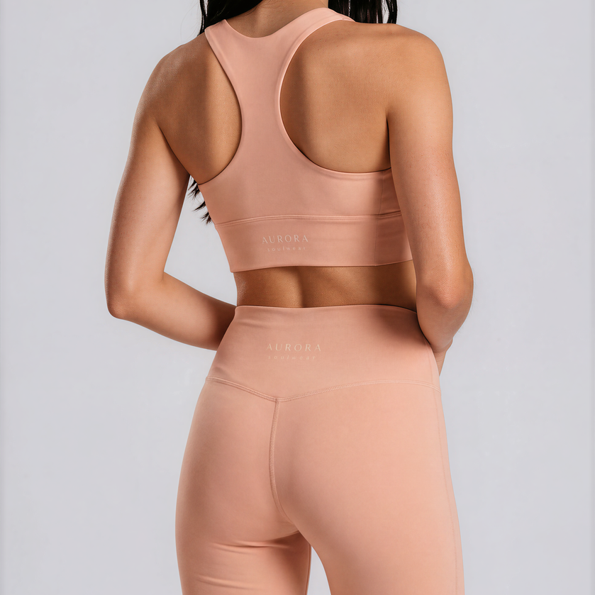 Duna Recycled Sport Top in warm peach tone with brand back detail