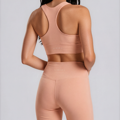 Duna Recycled Sport Top in warm peach tone with brand back detail