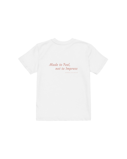White organic cotton kids t-shirt with a small heart on the chest, Aurora Soulwear.
