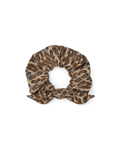Leopard-print hair scrunchie with removable bow, from Aurora Soulwear's Heatwave collection.