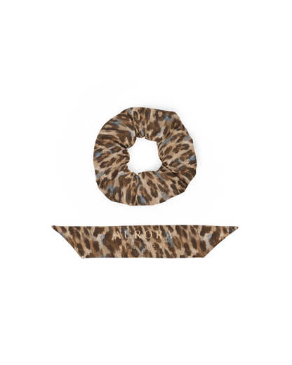 Leopard-print hair scrunchie with removable bow, from Aurora Soulwear's Heatwave collection.
