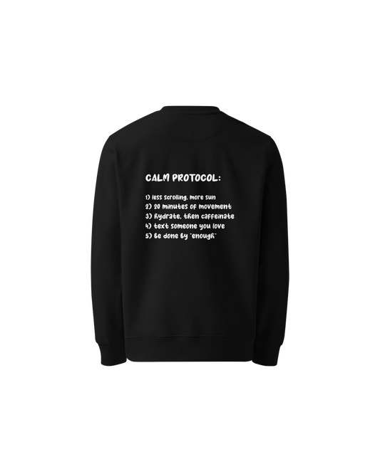 Protocol Organic Sweater in black with Calm Protocol back print