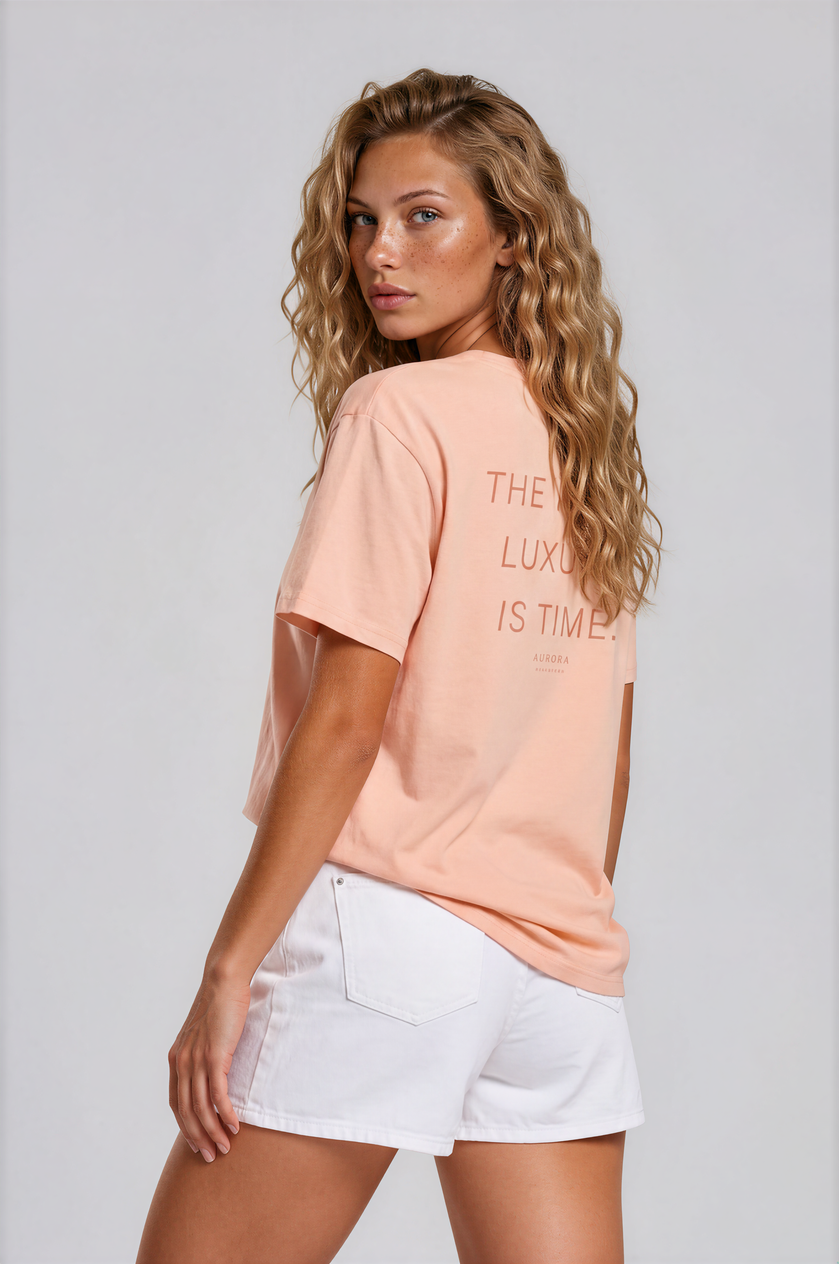 Time Organic Cotton T-shirt in peach with 'The Real Luxury Is Time' back print
