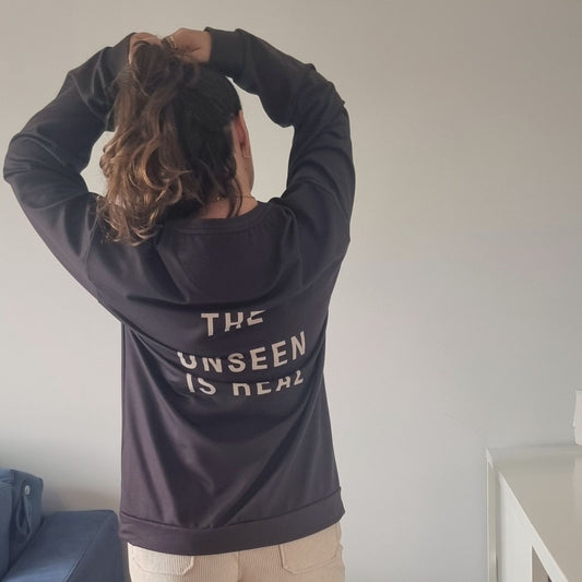 Unseen Recycled Sweater in chocolate brown with The Unseen Is Real back print