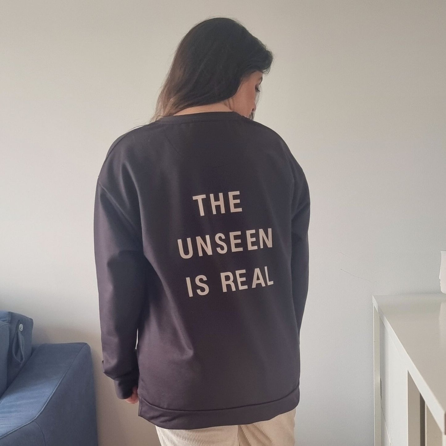 Unseen Recycled Sweater in chocolate brown with The Unseen Is Real back print